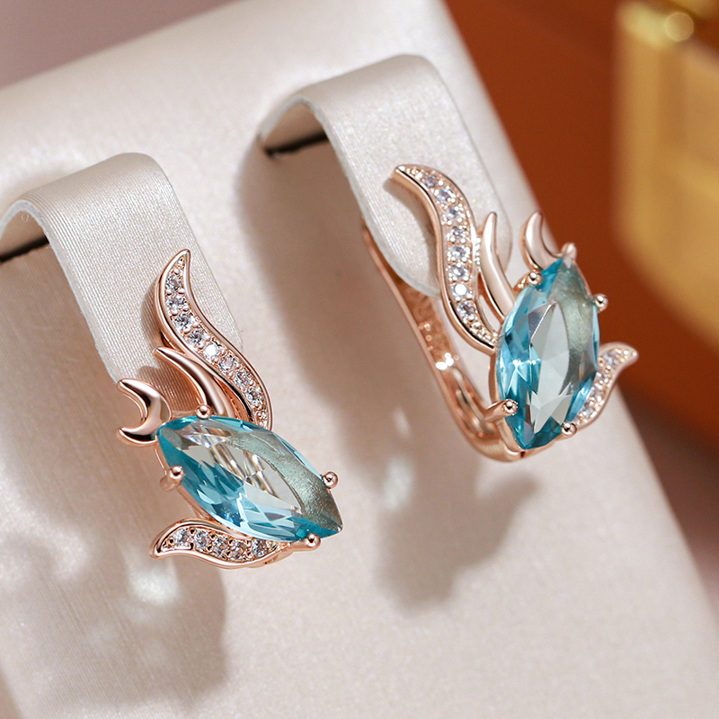 Elegantní zlaté náušnice zdobené tyrkysovými krystaly